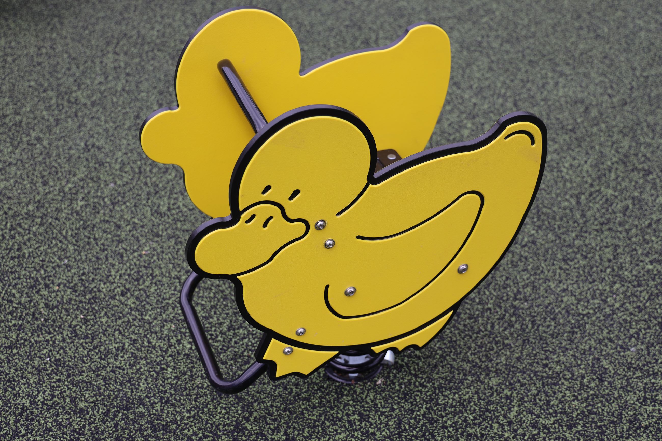 New duck riding toy on the playground at the petting farm. 