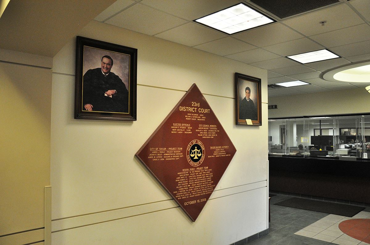 Court Hallway plaque and judge photos.