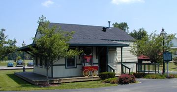A small house-like building painted white and blue.